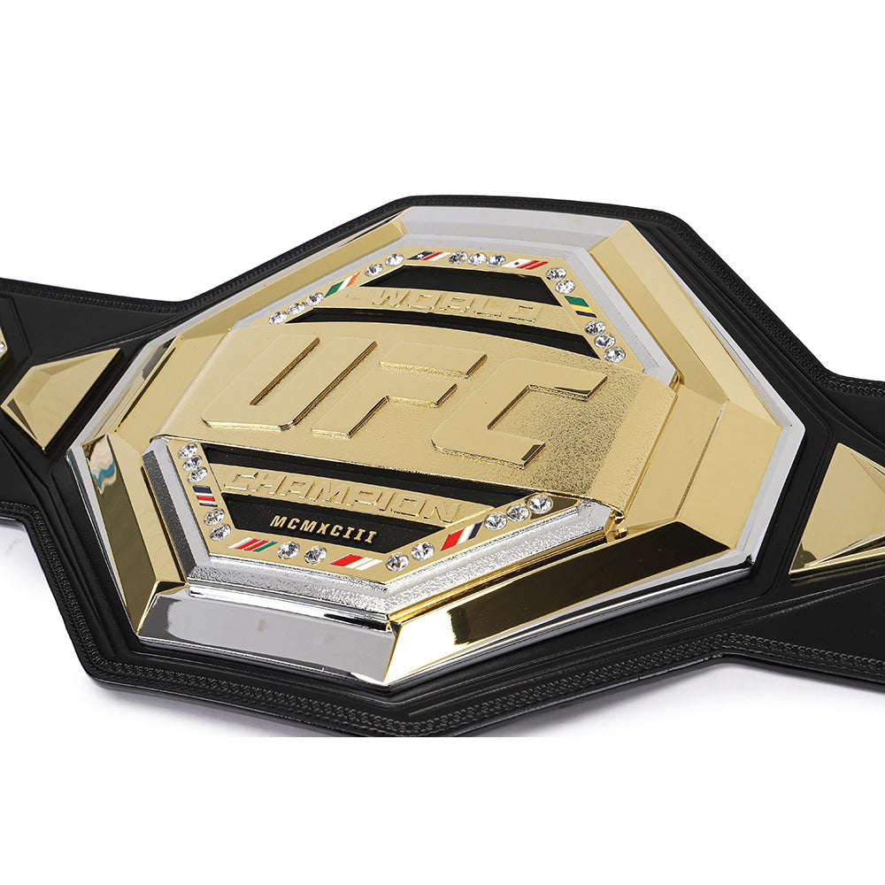 Close-up of UFC legacy replica belt with gold and black detailing from Championship Belt Store